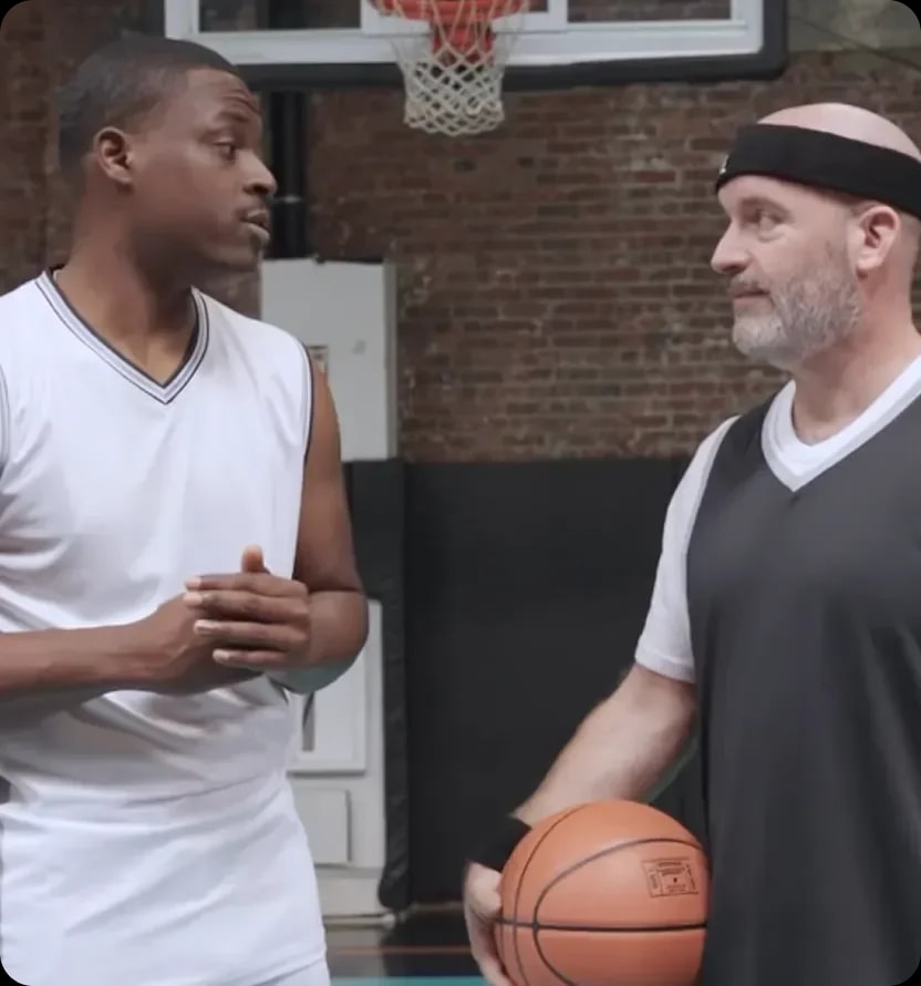 Tom Segura in a conversation on a basketball court